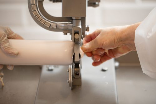 Knitting a tissue with sewing machine. High quality photo